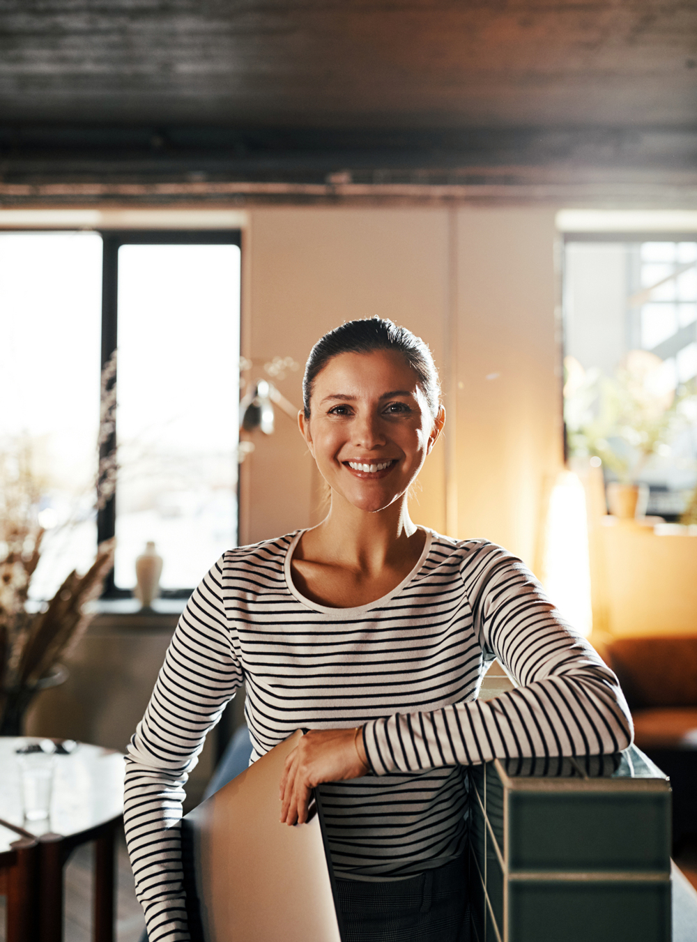 woman smiling in office ready for diversity and inclusion coaching